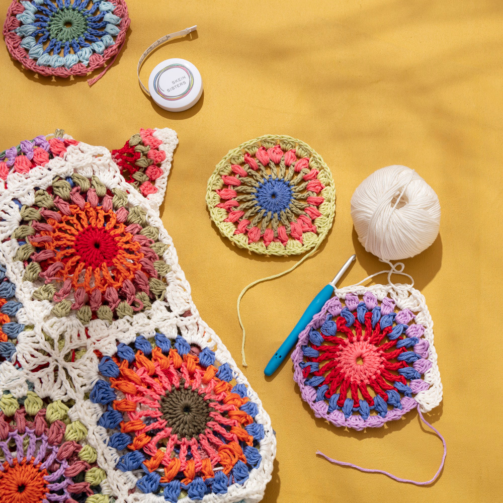 Colourful crocheted cotton Granny Square blanket