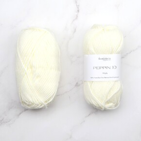 in threes: a baby cardigan set in Peppin 10: 1001 White, size 0-6 months